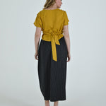 High-waisted sculptural skirt in structured wool blend by Lumina Eligma
Architectural wool-blend skirt with pinstripes – Lumina Eligma
Luxury designer skirt with asymmetrical draping
Modern tailored skirt for women – Lumina Eligma
