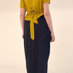 High-waisted sculptural skirt in structured wool blend by Lumina Eligma
Architectural wool-blend skirt with pinstripes – Lumina Eligma
Luxury designer skirt with asymmetrical draping
Modern tailored skirt for women – Lumina Eligma
